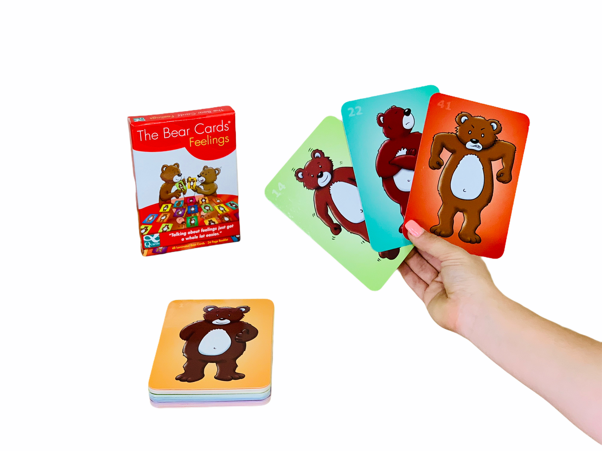 a hand holding 3 of the Bear Cards Feelings cards in front of the box