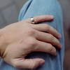 hand resting on blue jeans wearing the Star &amp; Co Anxiety Jewellery - The Jake Ring