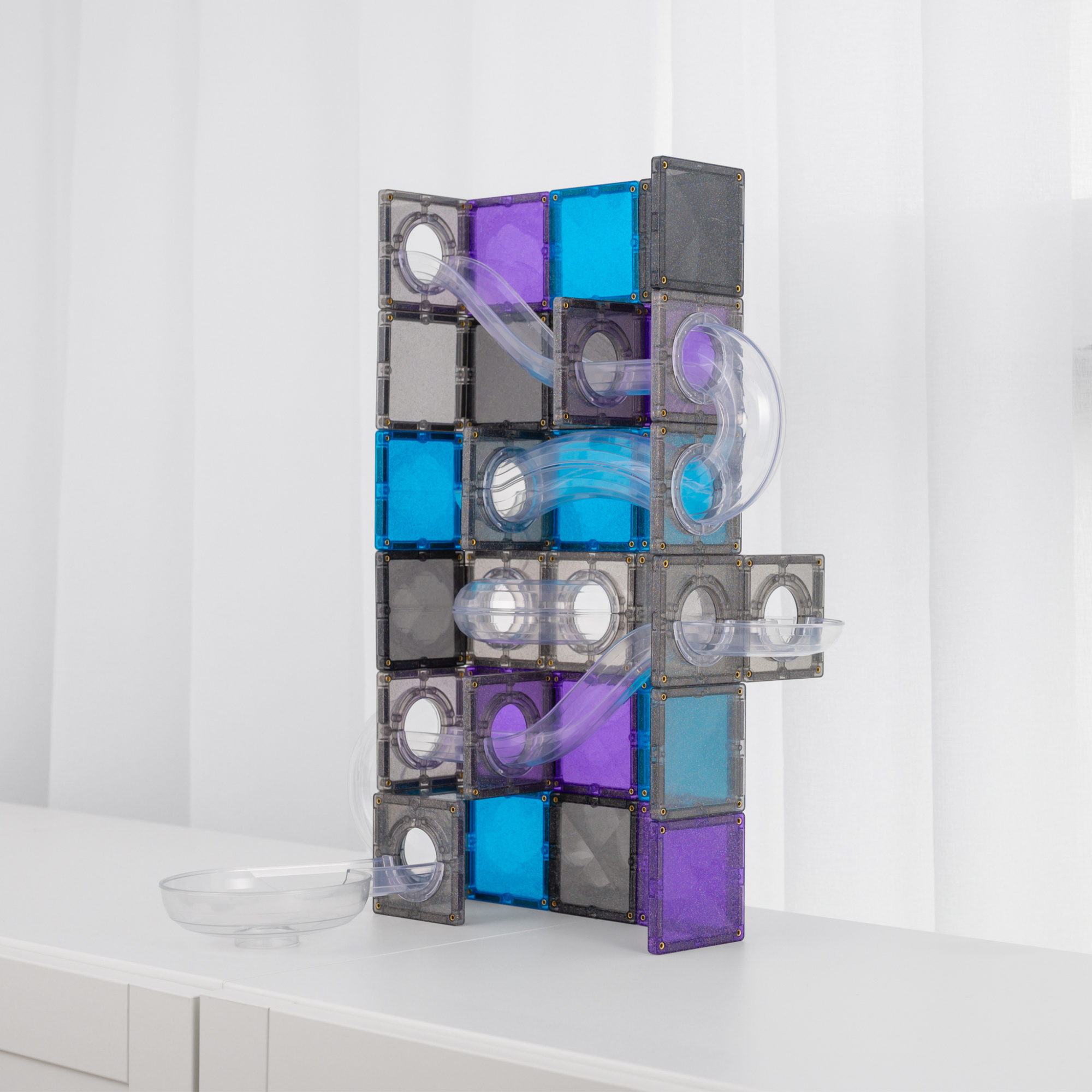 The Connetix Ball Run - Galaxy Pack 61pc installed on a white table
