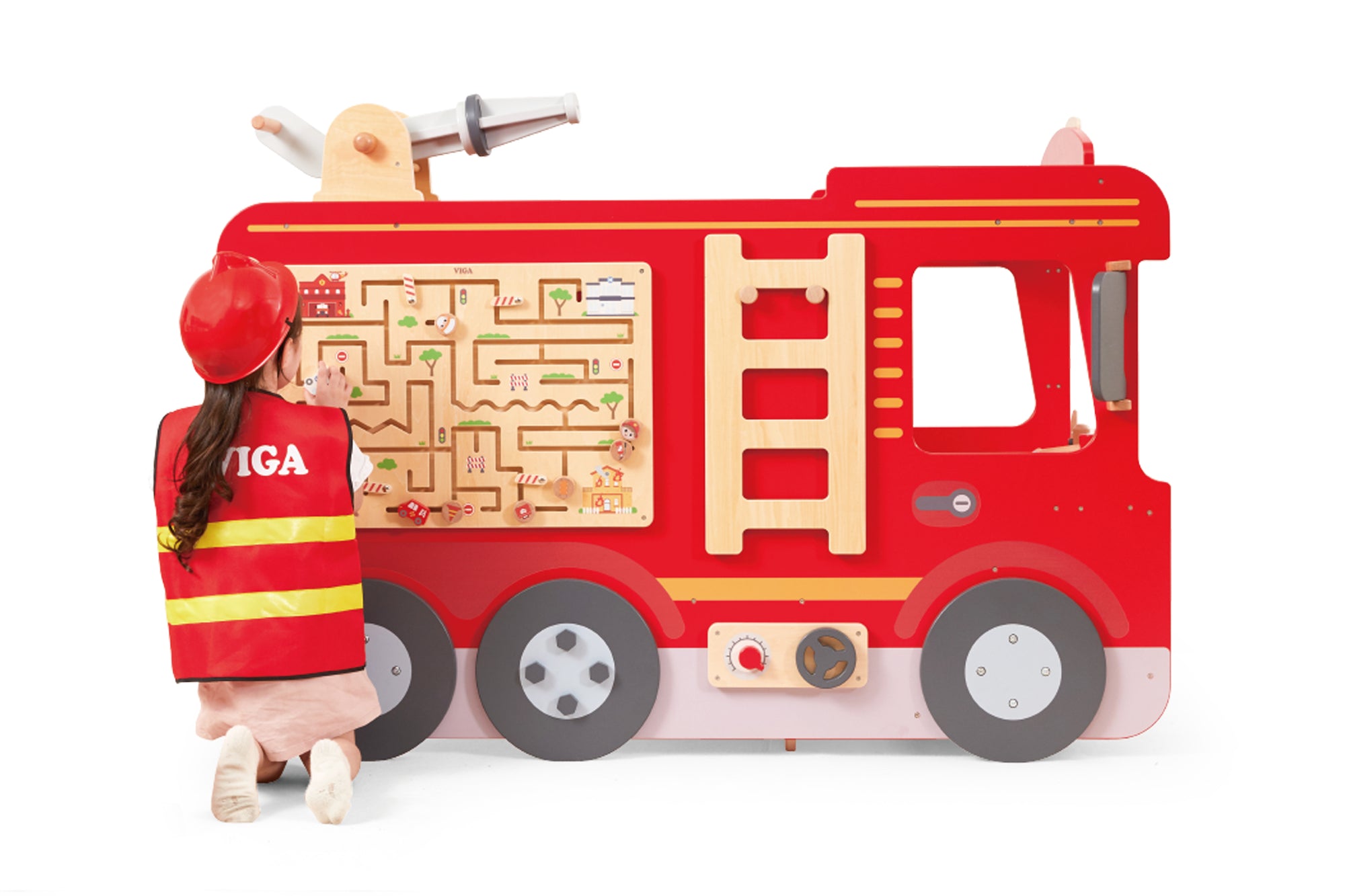 A young girl kneeling next tp and playing with the Viga Super Fire Engine Set