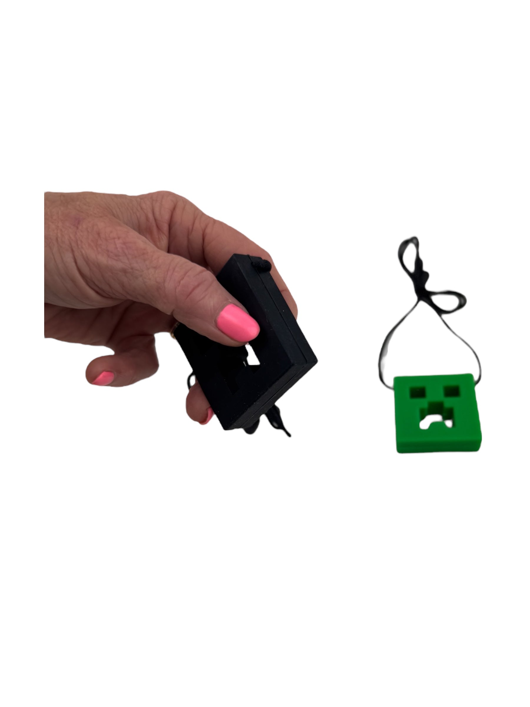 the Chewy Charms Necklace Chew - Creeper pictured on a white background