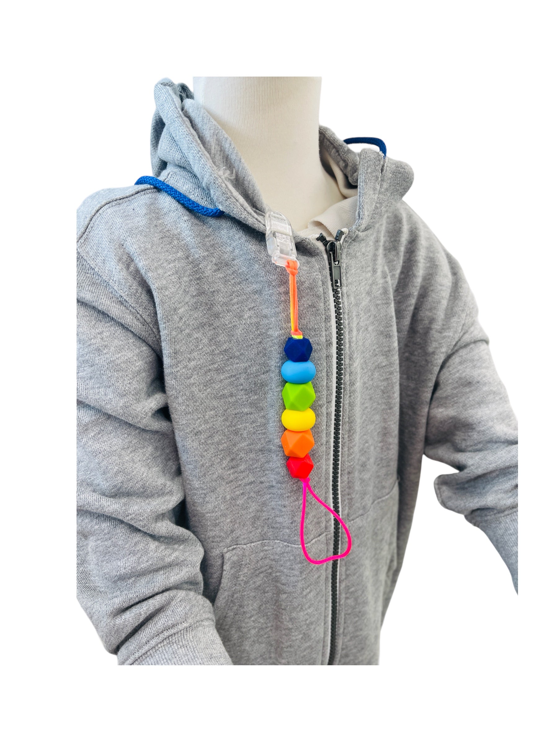 the rainbow Chewy Charms Chewy Loop Shirt Saver - Clip On attached to a grey jumper on a manikin 