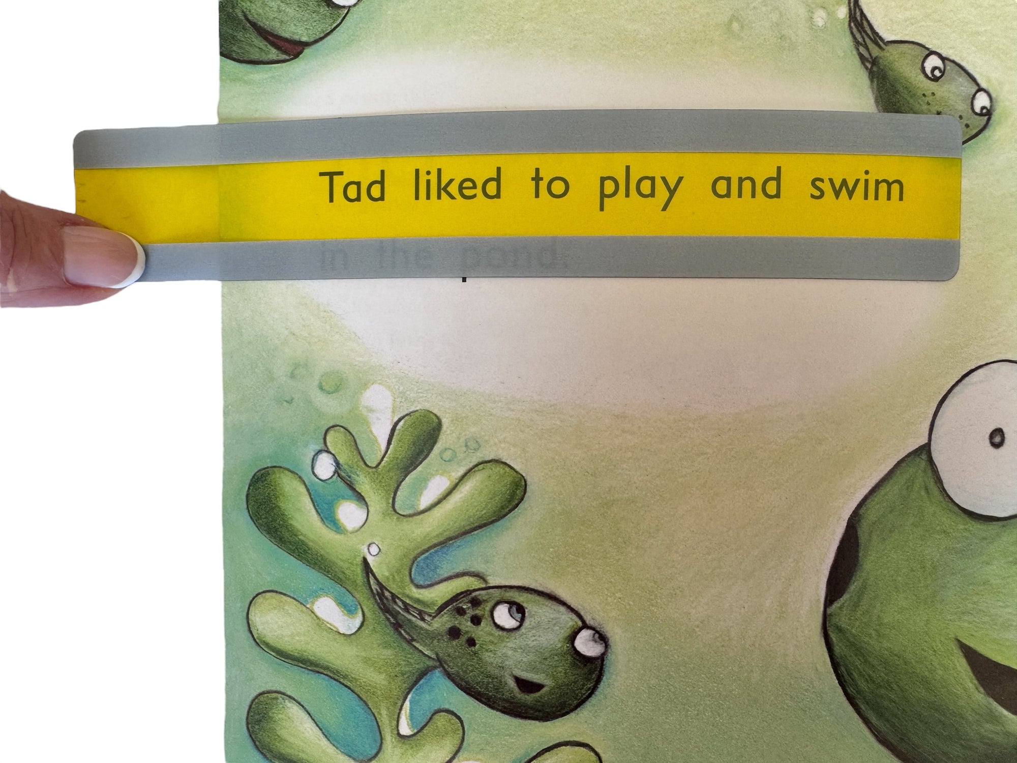 The yellow Coloured Reading Guide - Extra Wide used on a children's book