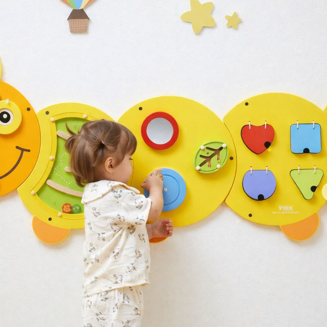 A young girl playing with the VIGA Interactive Wall Mural Junior Caterpillar