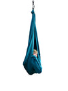 a young boy hiding in his Deluxe Compression Sensory Swing