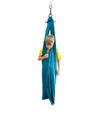 a young boy standing in the Deluxe Compression Sensory Swing