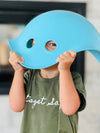 a young boy using the blue Bilibo as a hat