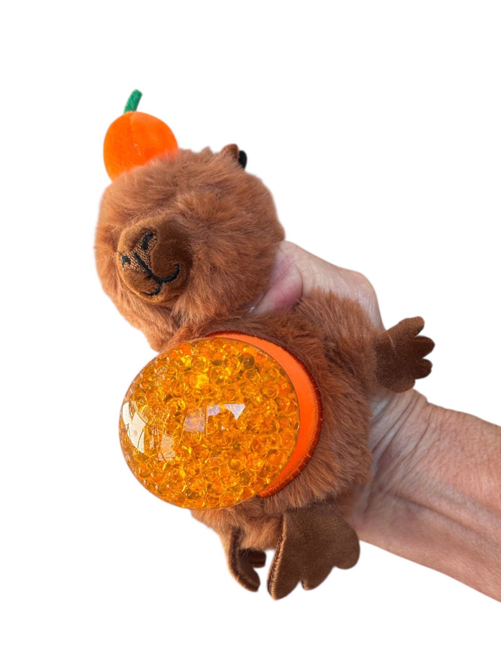 The Jellyroo Capybara Plush Stress Ball squeezed and pictured on a white background