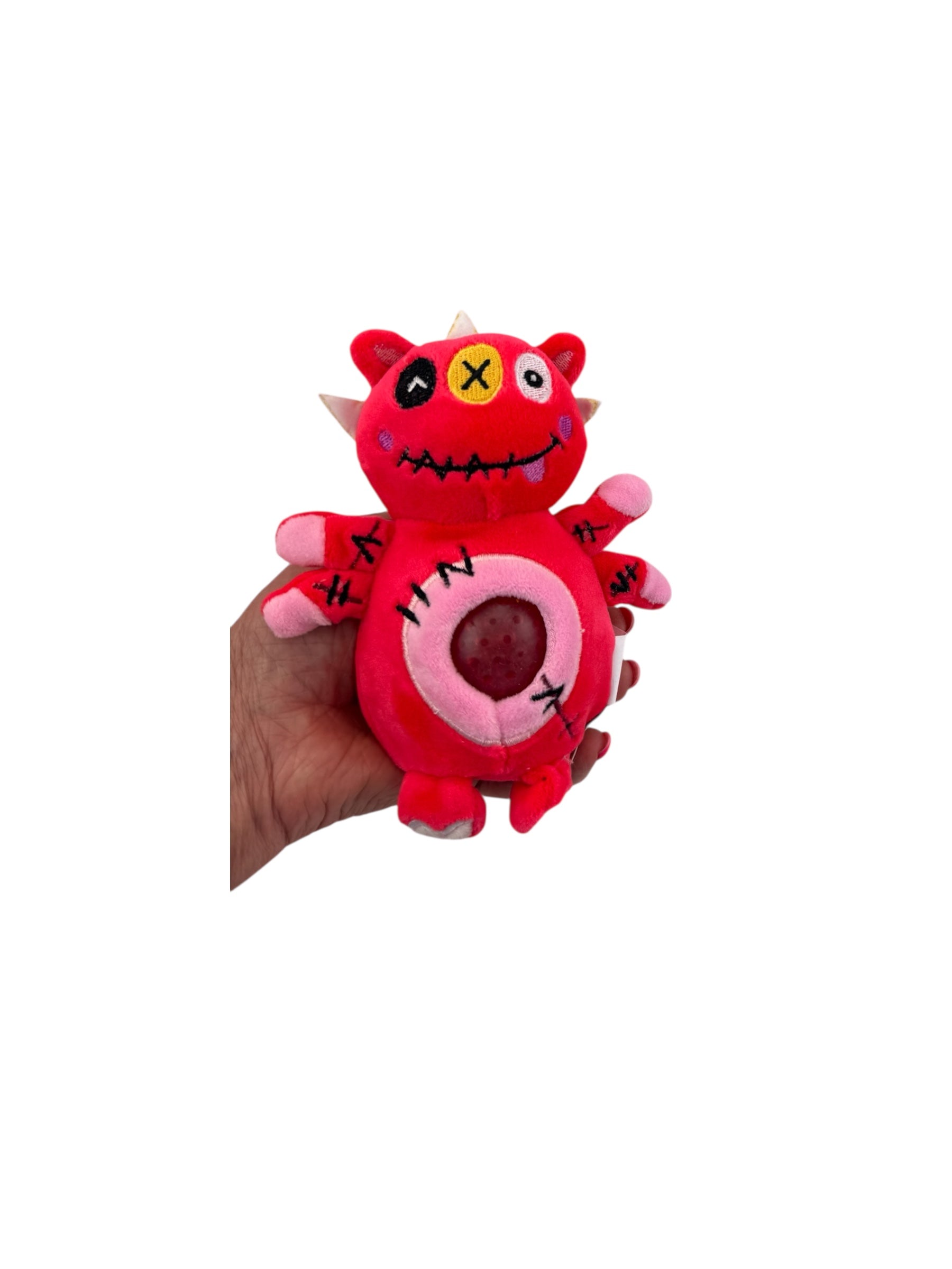 a hand holding the red Jellyroo Monster Stress Ball on a white background