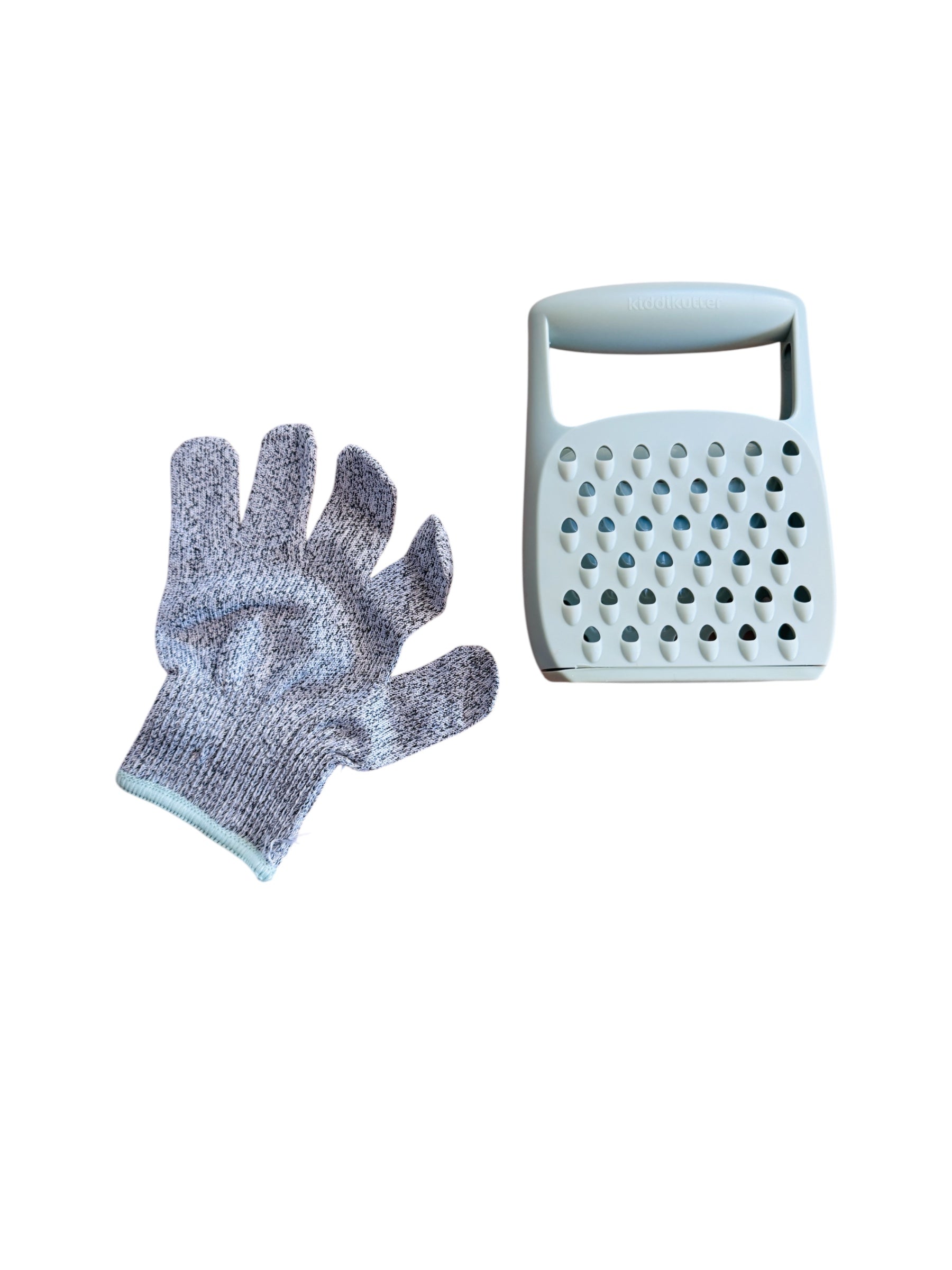 The Kiddikutter Safety Grater pictured alongside the glove that comes with product