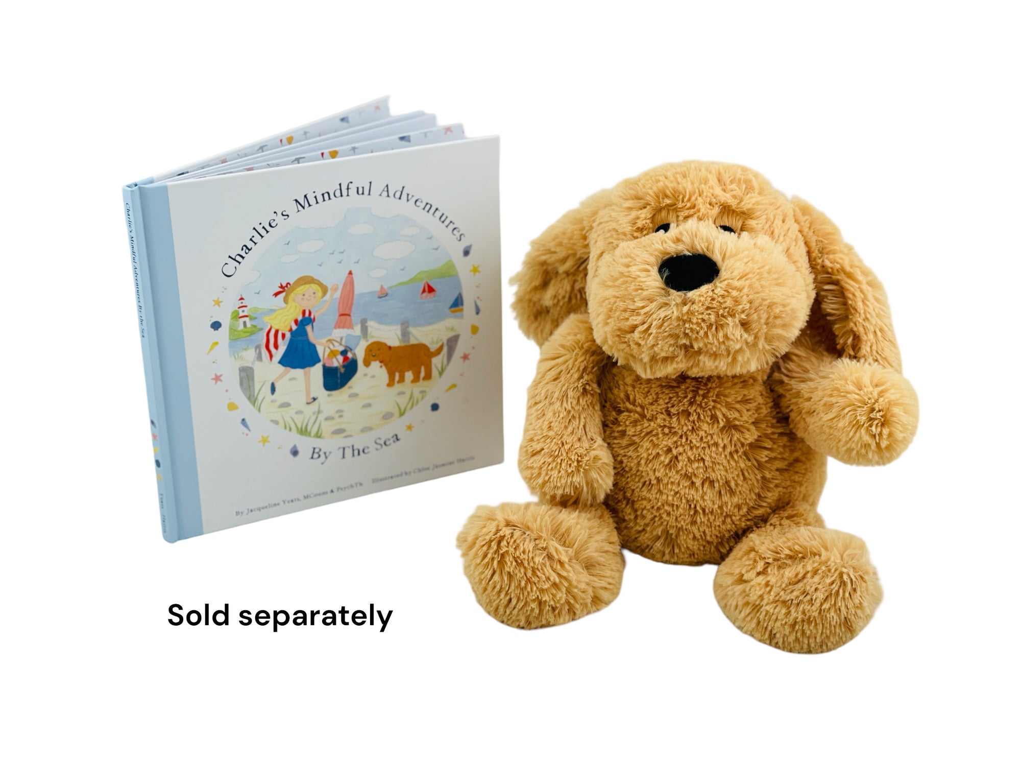 The Mindful &amp; Co Charlie The Weighted &amp; Scented Puppy sitting next to the mindful and co charlies, mindful adventures book