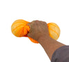 a hand squishing the orange Super Nee Doh - Ripples