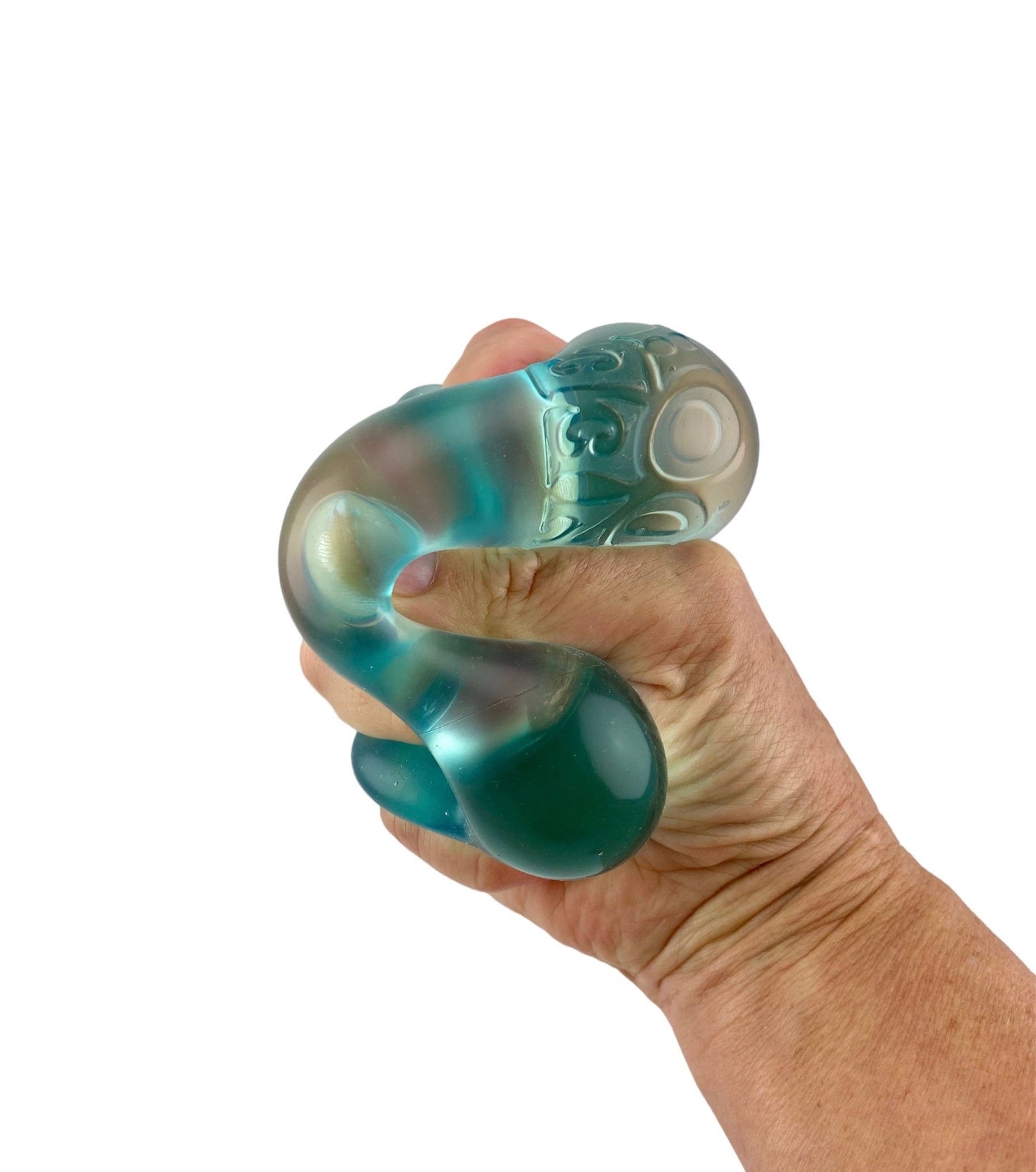 a hand squishing the Nee Doh Stress ball Nice Cube