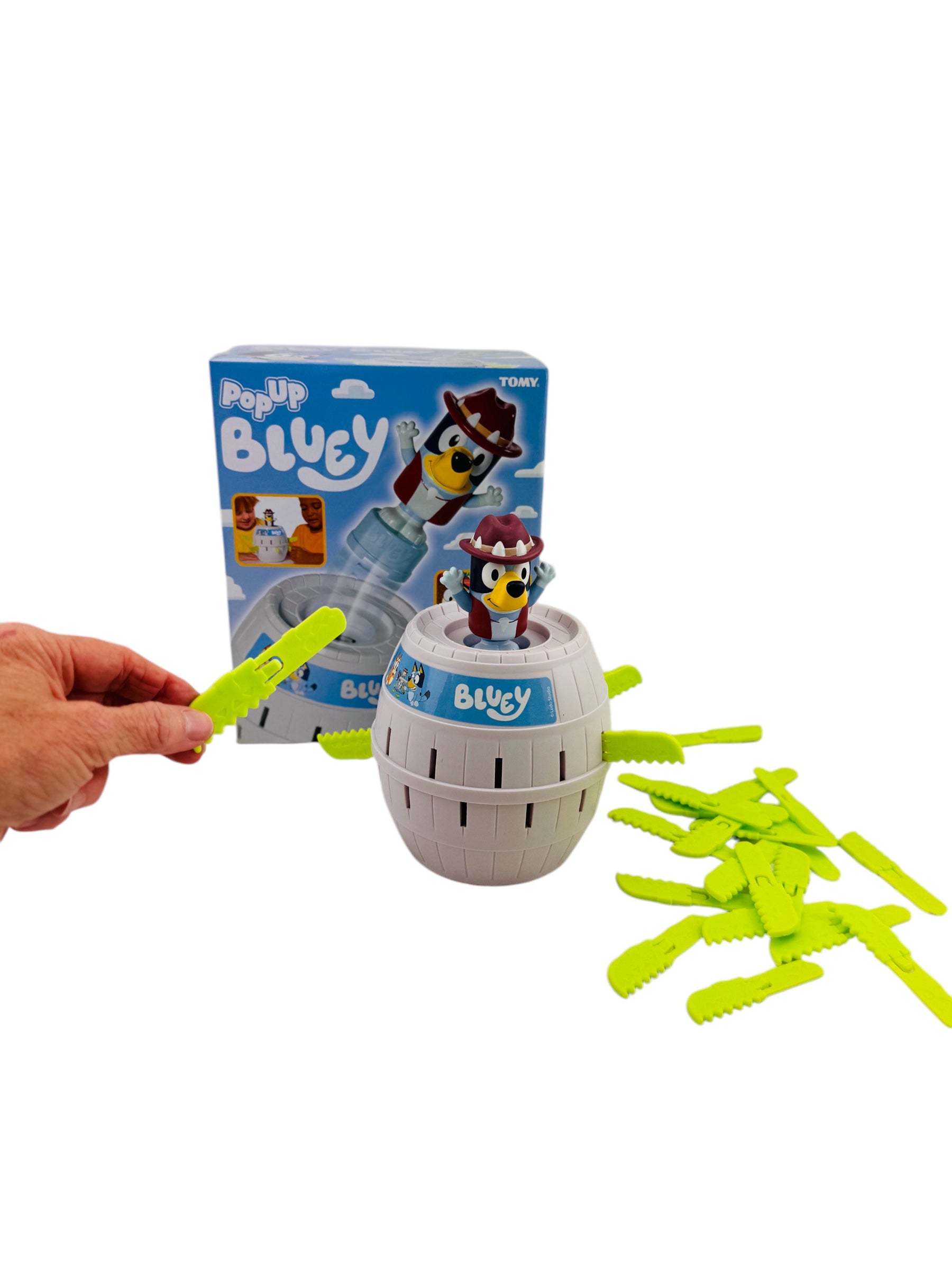 a person playing the Pop Up Bluey Fine Motor Game