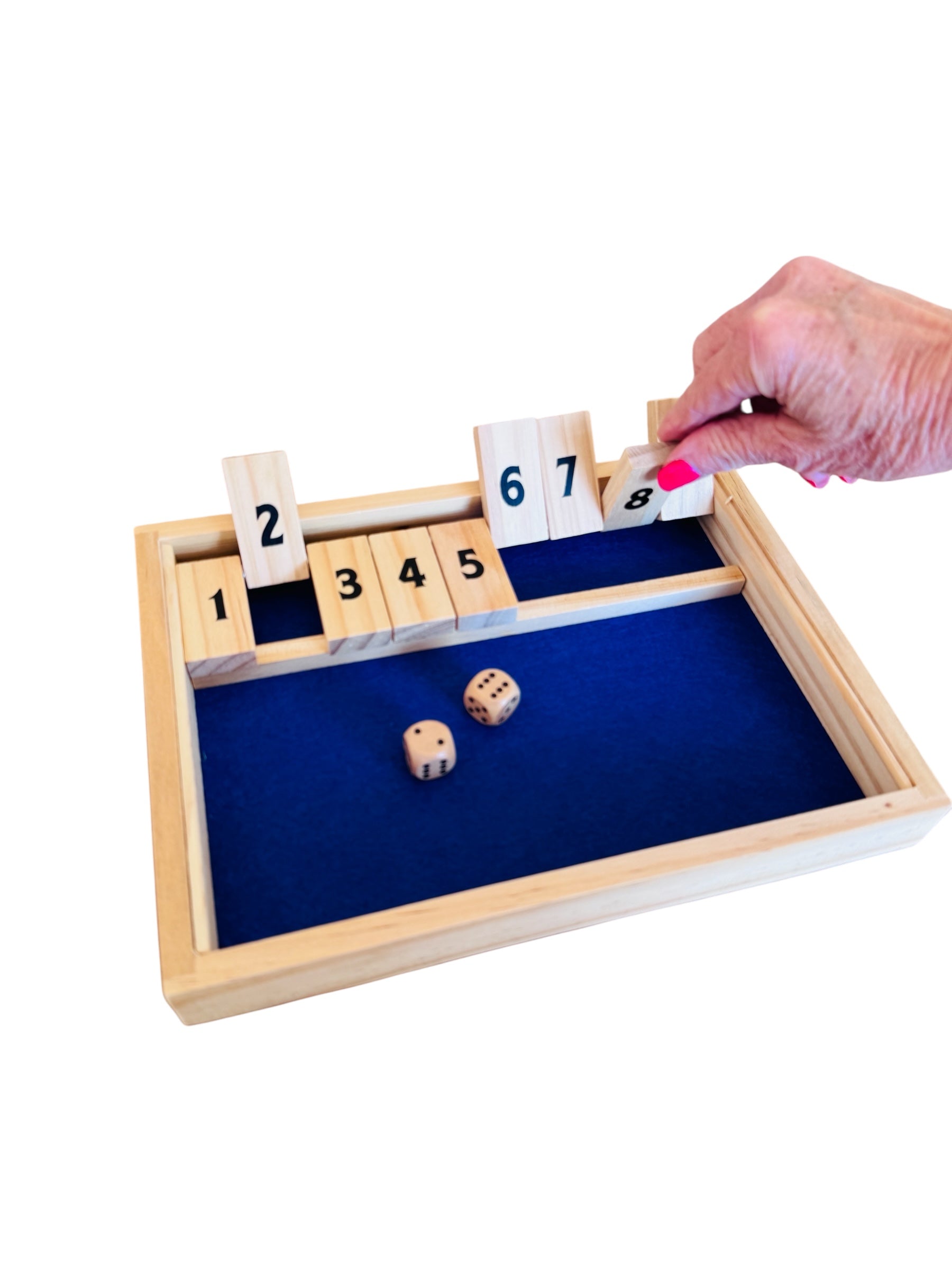A person playing the Shut the Box game