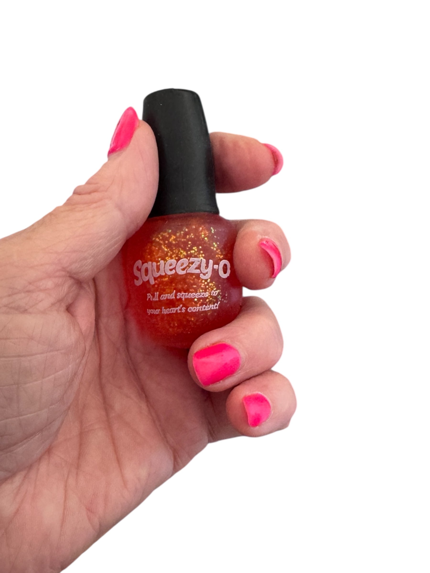 A hand holding the red Smoosho's Glitter Nail Polish