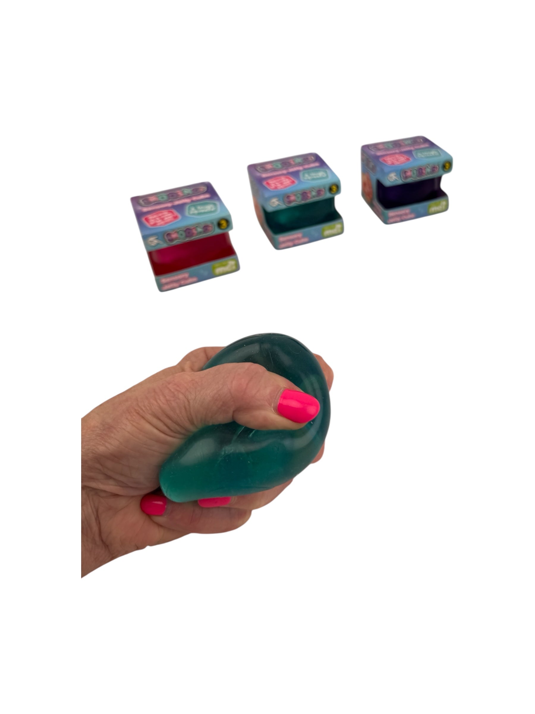 A hand squeezing a blue Smooshos Jelly Stress Cube