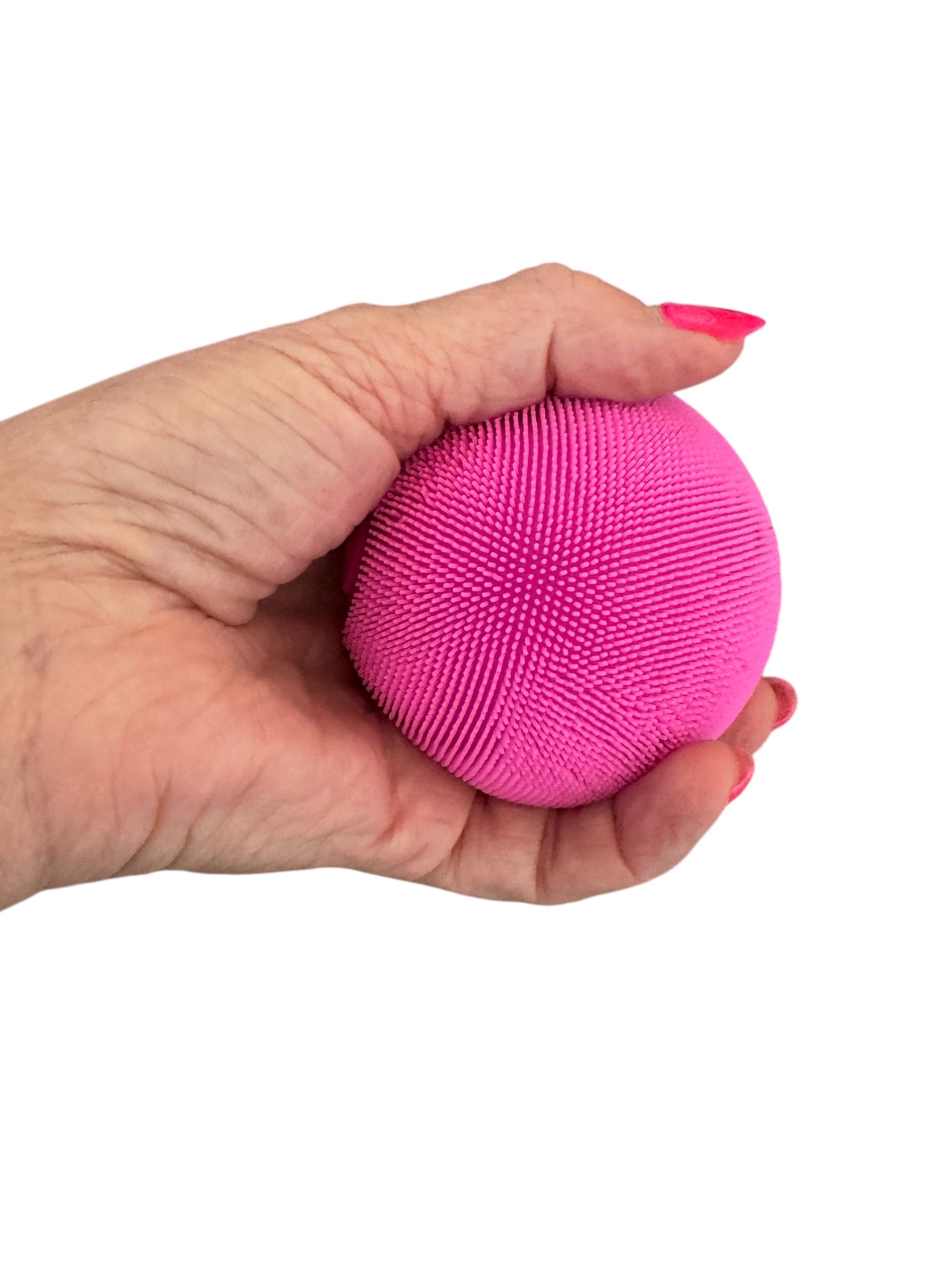 a hand holding the Smooshos Squishy - Colour Change Furry Ball