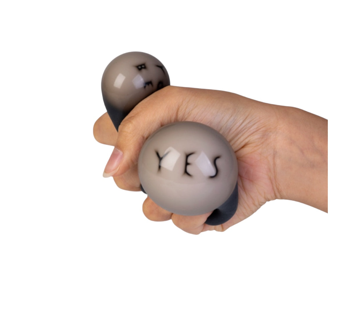 A hand squeezing the Smooshos Squishy - Magic Fortune Ball
