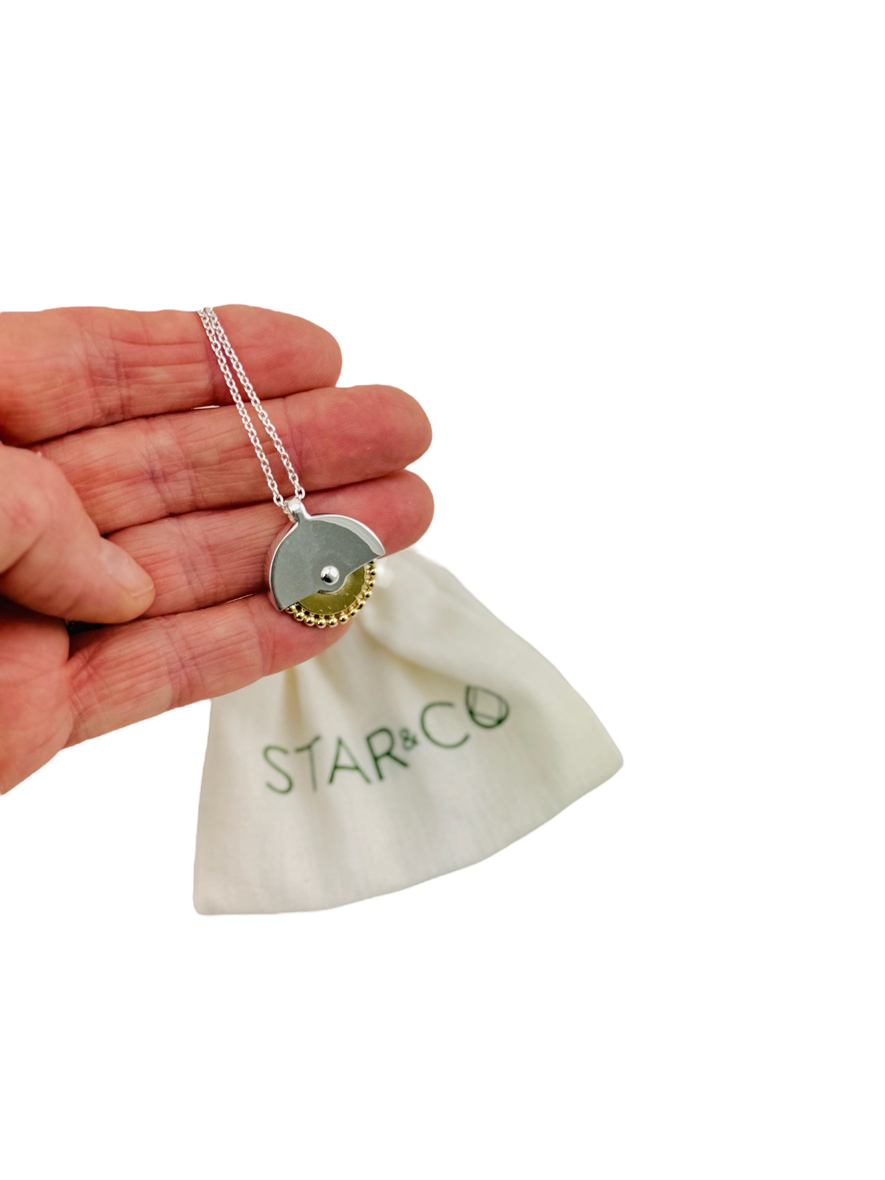 a hand holding the Star &amp; Co Anxiety Jewellery - The Sacha Necklace