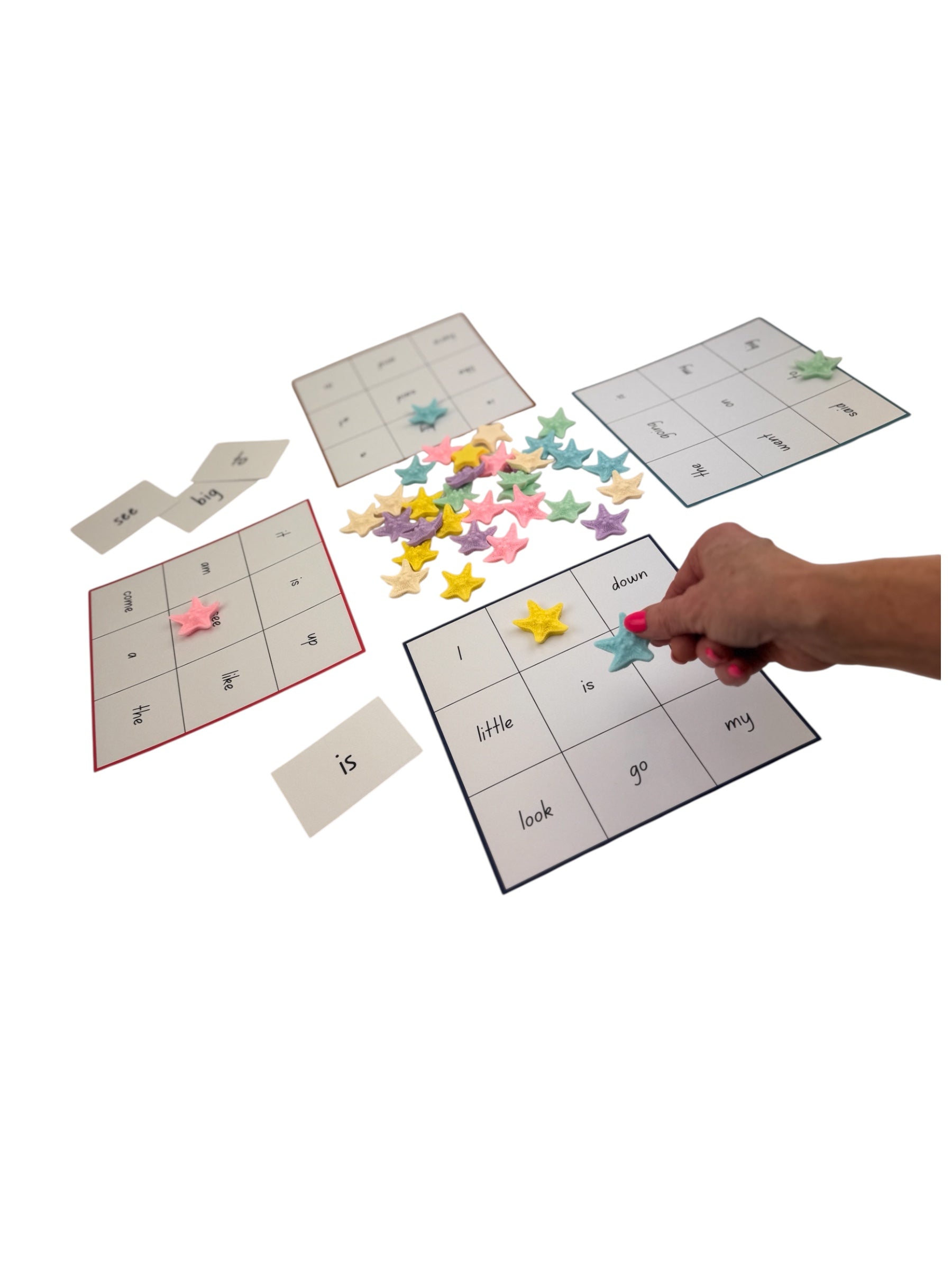 Educational game with letter cards and star-shaped letter pieces on a white background