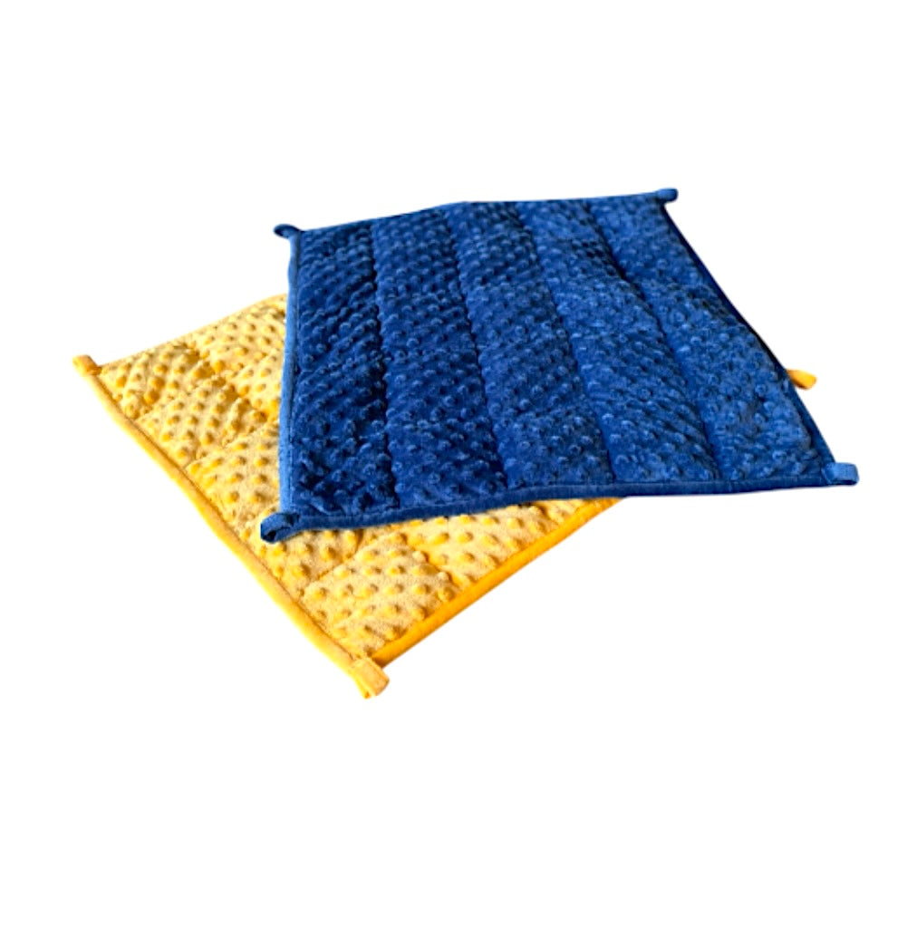 The yellow and blue Starfish Weighted Lap Pads pictured on a white background