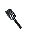 the black Kaiko Sensory Hairbrush pictured on a white background
