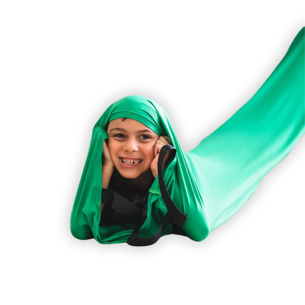 A young boy crawling in the green Deluxe Lycra Compression Tunnel