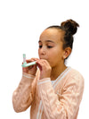 a young girl breathing into the Webe Kalm Calming Breath tool