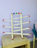 The Fagus Wooden Marble Run XL on display with the 4 balls and disc rolling down the marble run