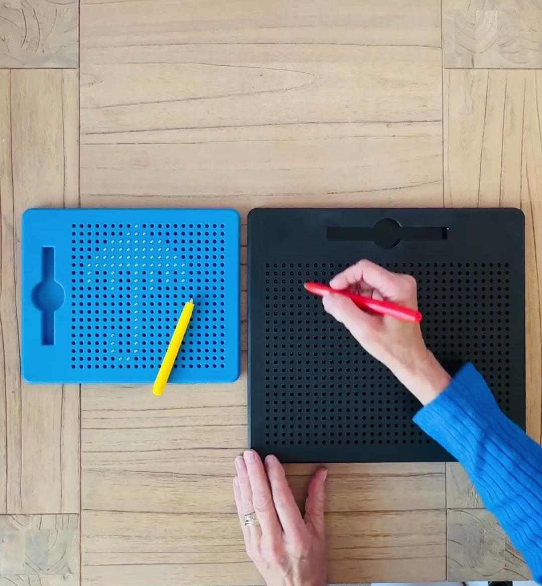 a clip of a teacher using the MagnaPad Magnetic Sketchpad