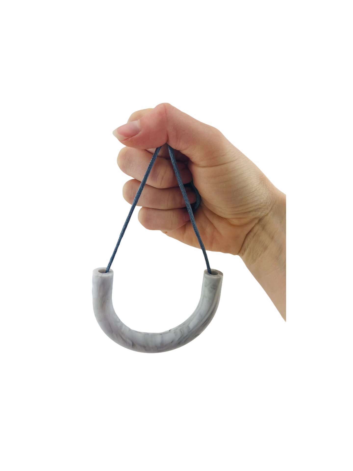 a hand holding the marble Chewy Charms Necklace Chew - U tube on a white background