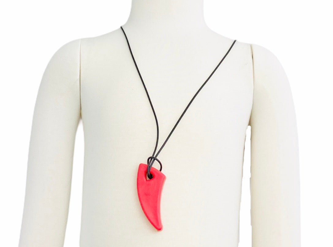 Ark Saber Tooth Chew - Standard/Red displayed on manakin with white background