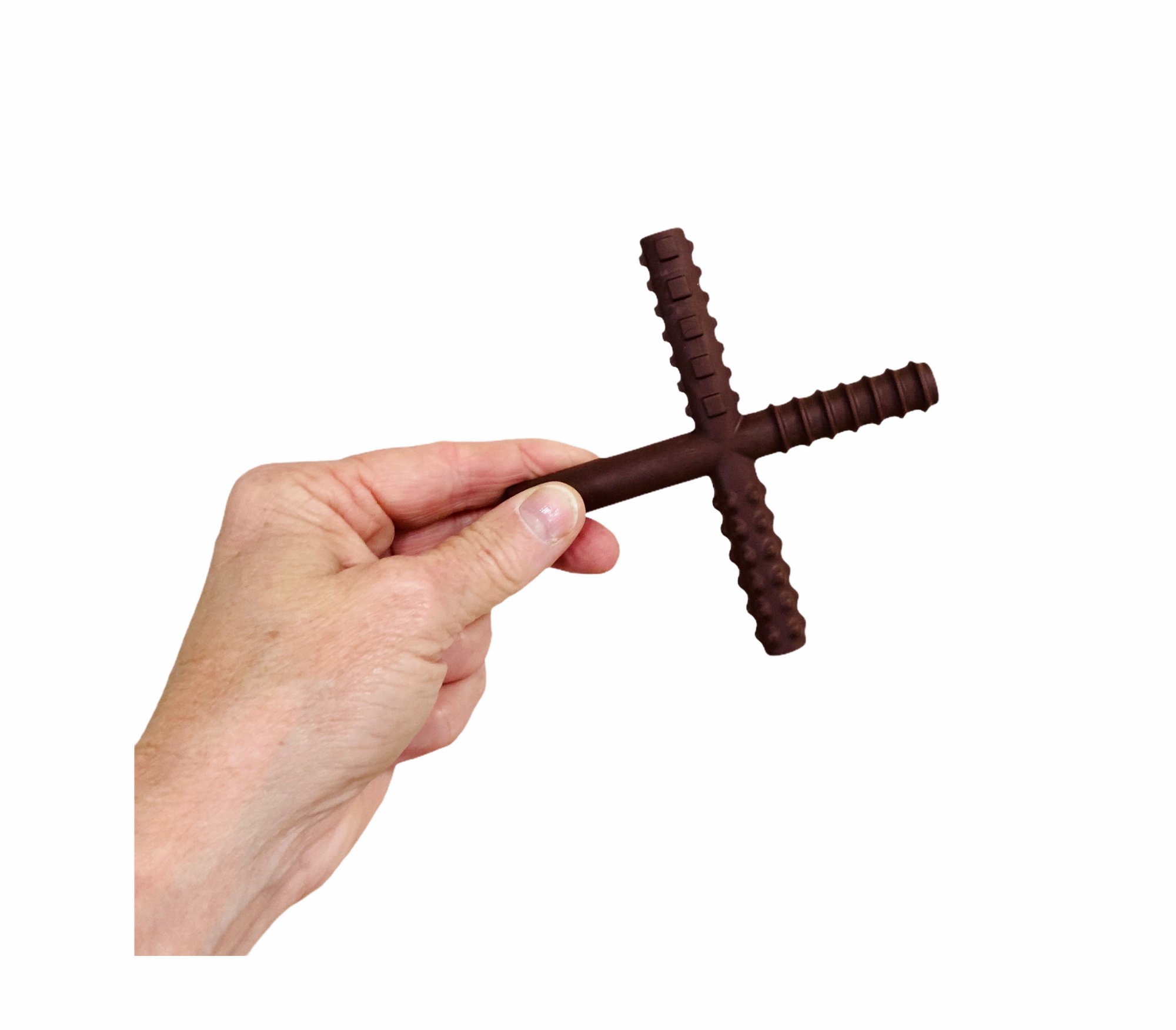 a hand holding the brown Chew Stixx Original chocolate