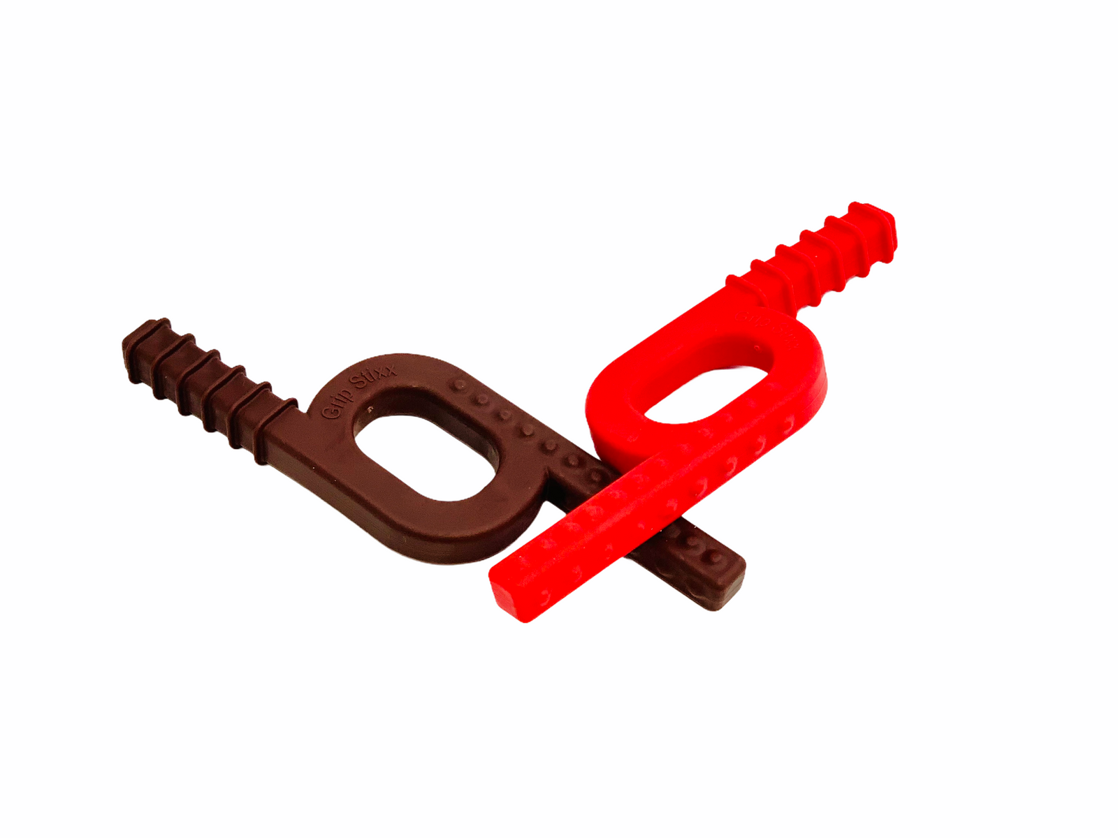 The Chew Stixx Grip stixx Plain resting on top of the Chew Stixx Grip stixx Chocolate