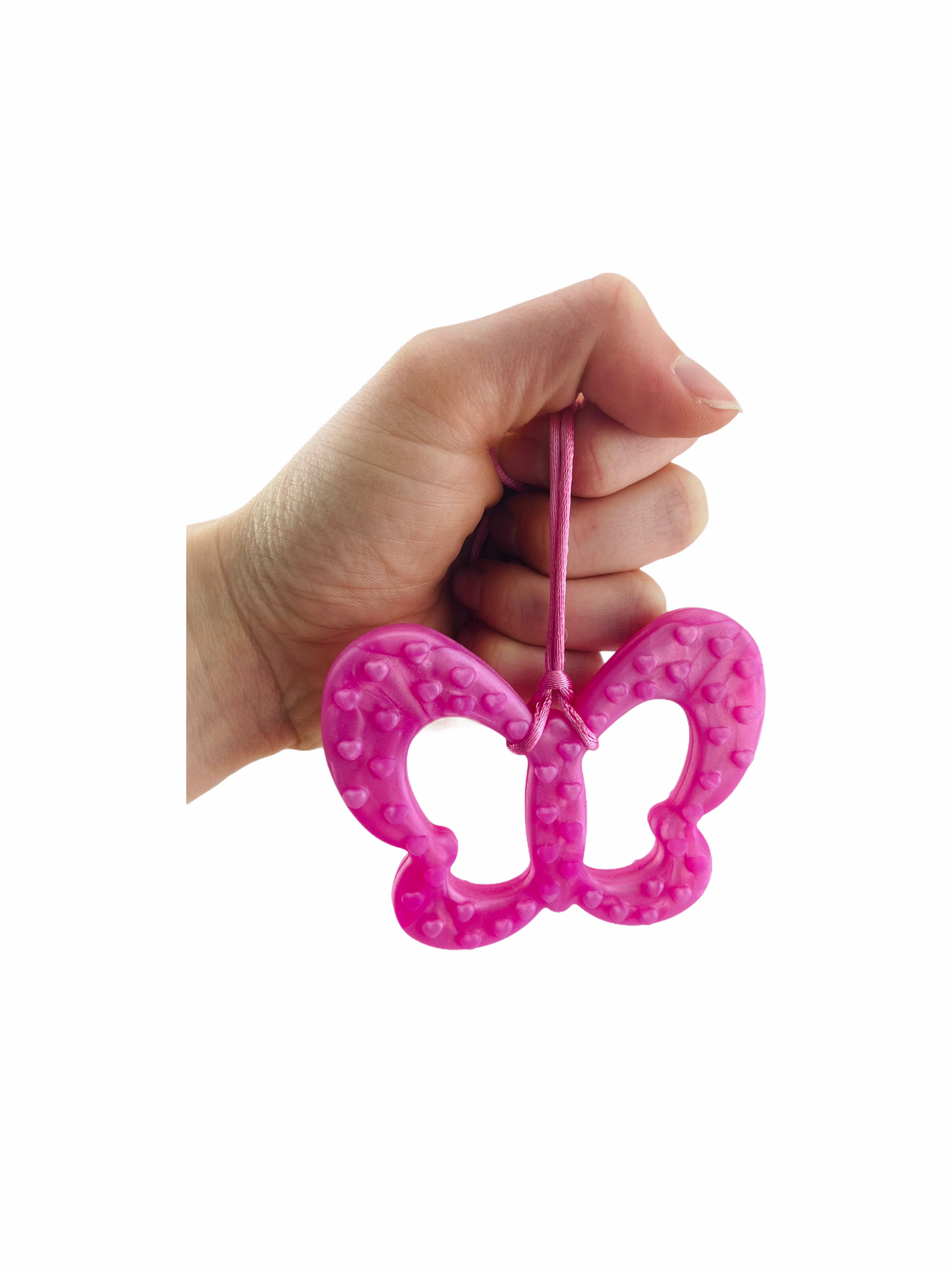 Hand holding Chewy Charms Necklace Chew - Pink/Butterfly on white background