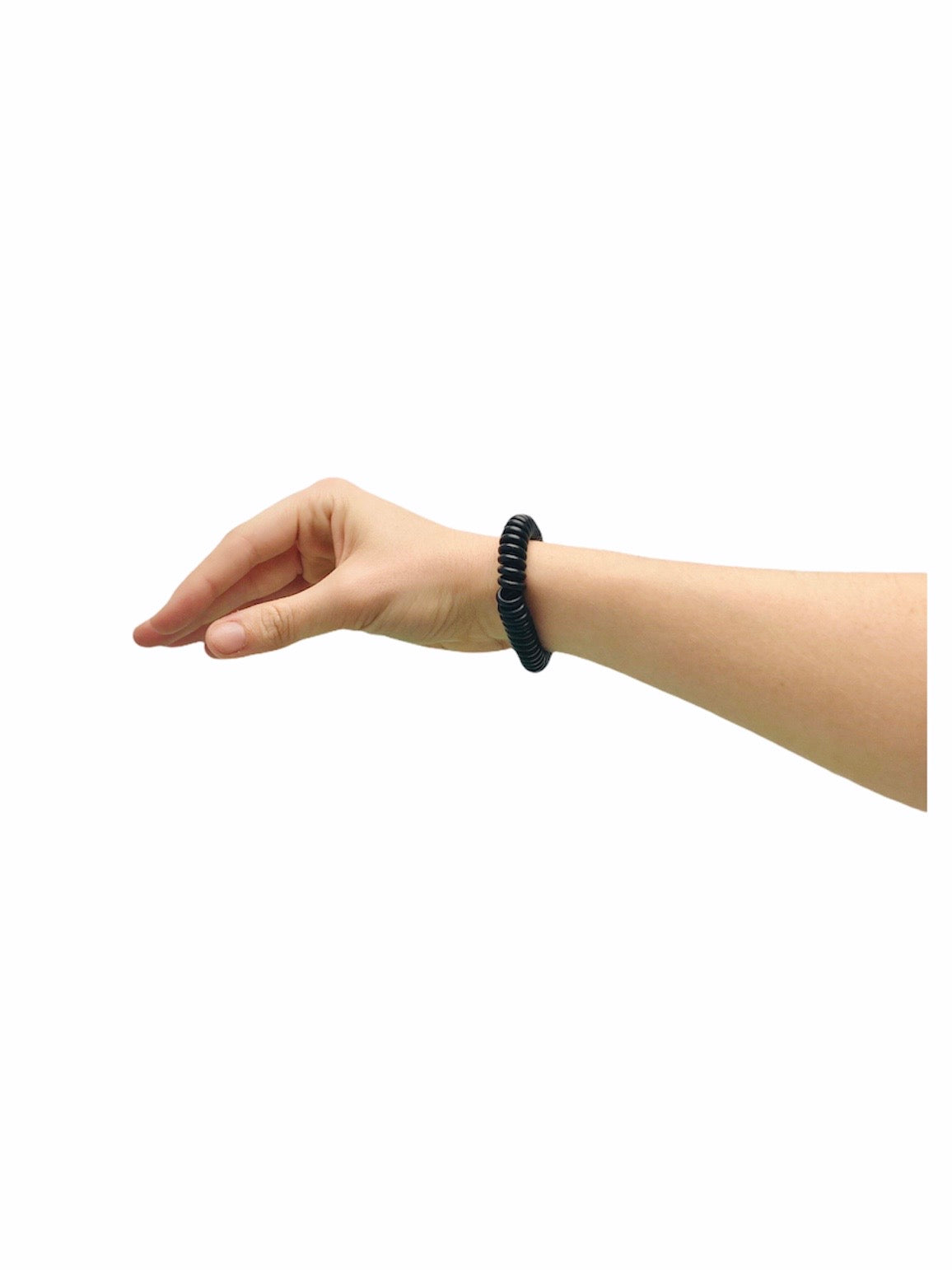 Wrist wearing the Chubuddy Springz Bracelet - Black with a white background