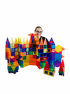 a woman standing behind a structure built from the Connetix Magnetic Tiles - 212 pieces set
