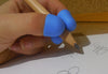 hand using the TPG Pencil Grip Claw Small