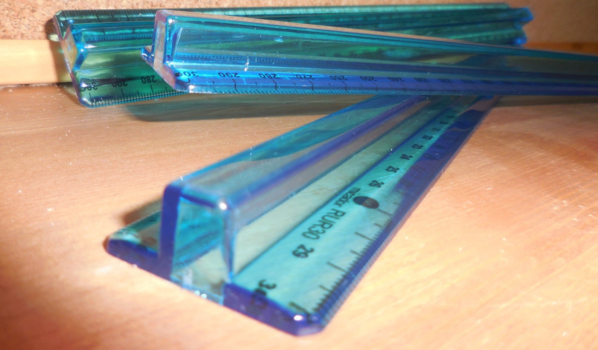3 Micador Review Rulers on wooden table