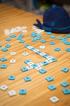 the Mobi Maths Game on display with tiles spread out on wooden table