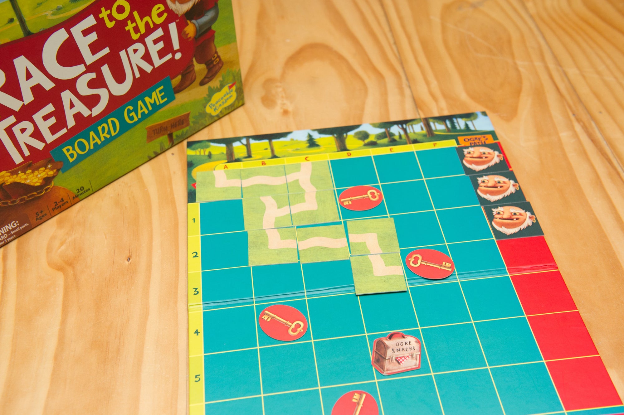 Peaceable Kingdom Race to the Treasure set out on wooden table