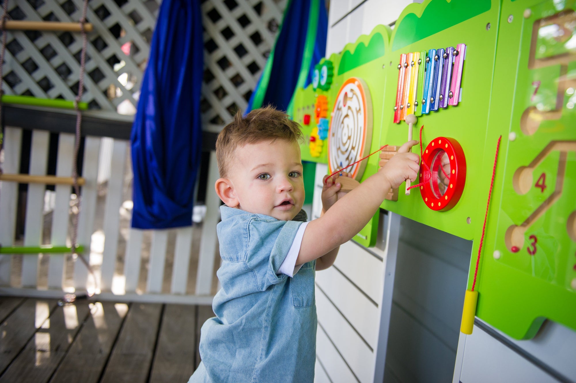 child playing the Viga Interactive Wall Mural Crocodile