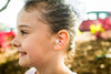 girl wearing the Vibes hi-fidelity noice reduction earplugs