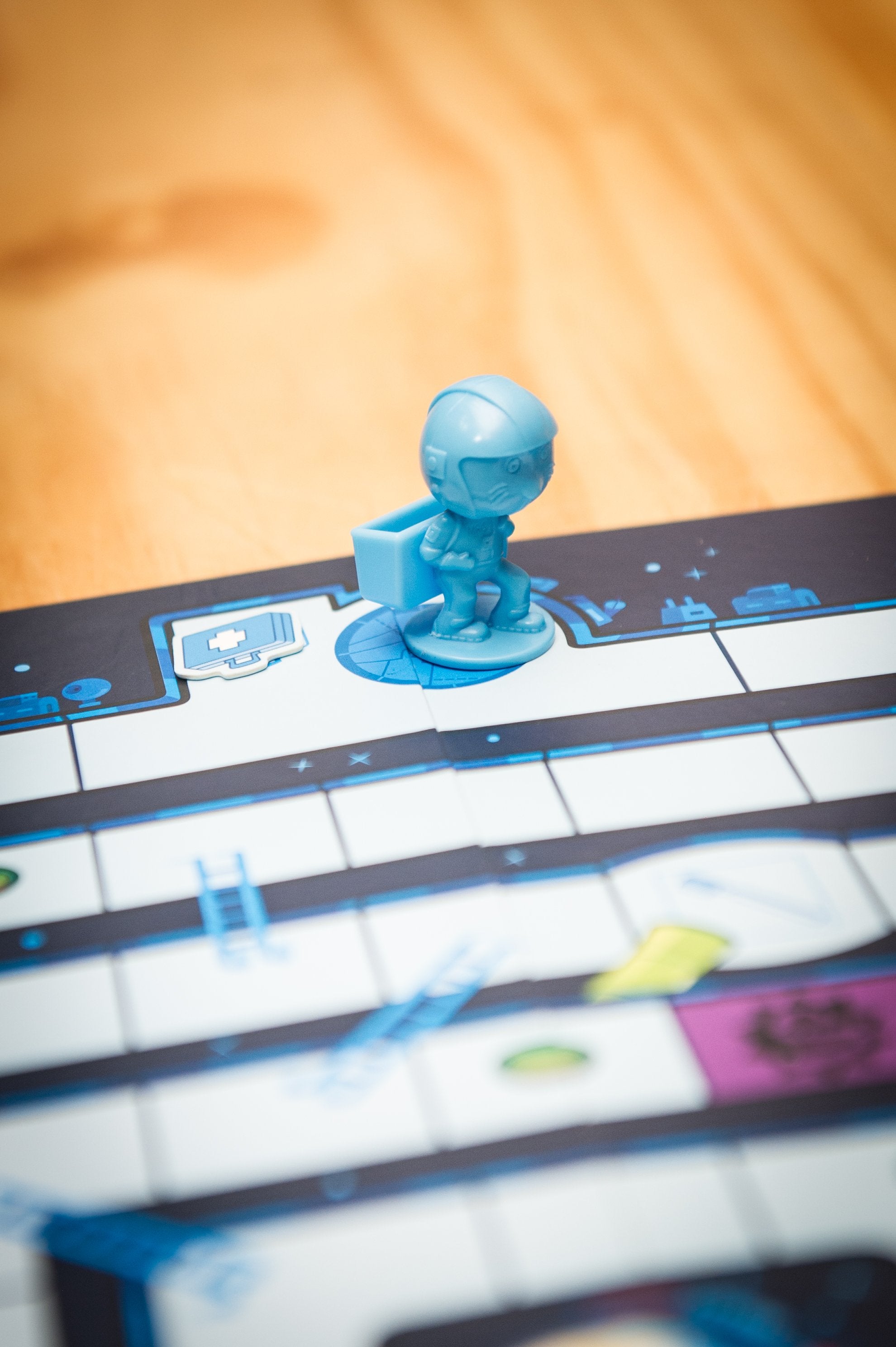 a piece from the peaceable Kingdom Space Escape on the board