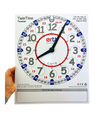 a hand holding the EasyRead Twin Time Teaching Clock