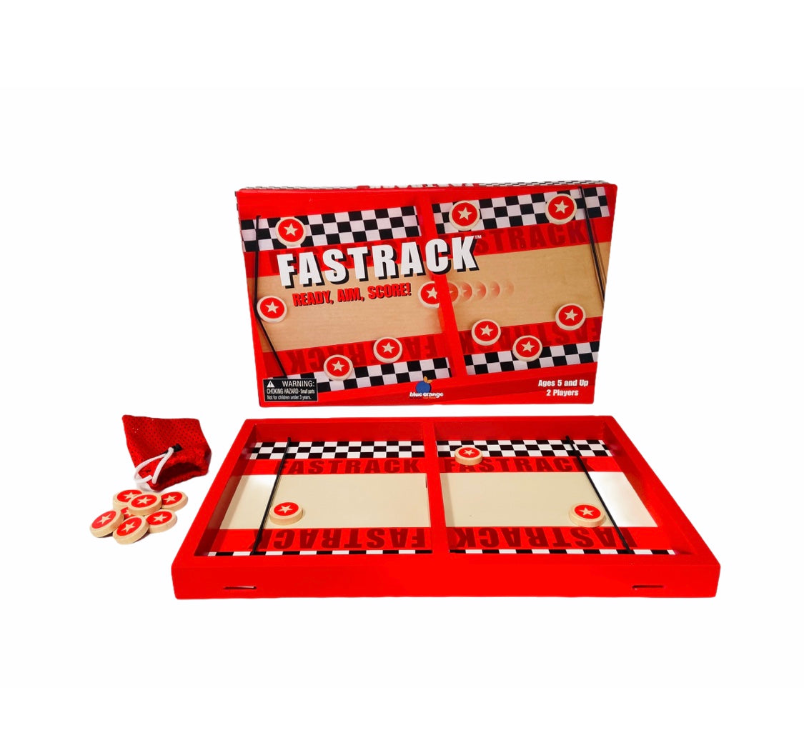 Fastrack Game with game discs piled next to playing board on white background