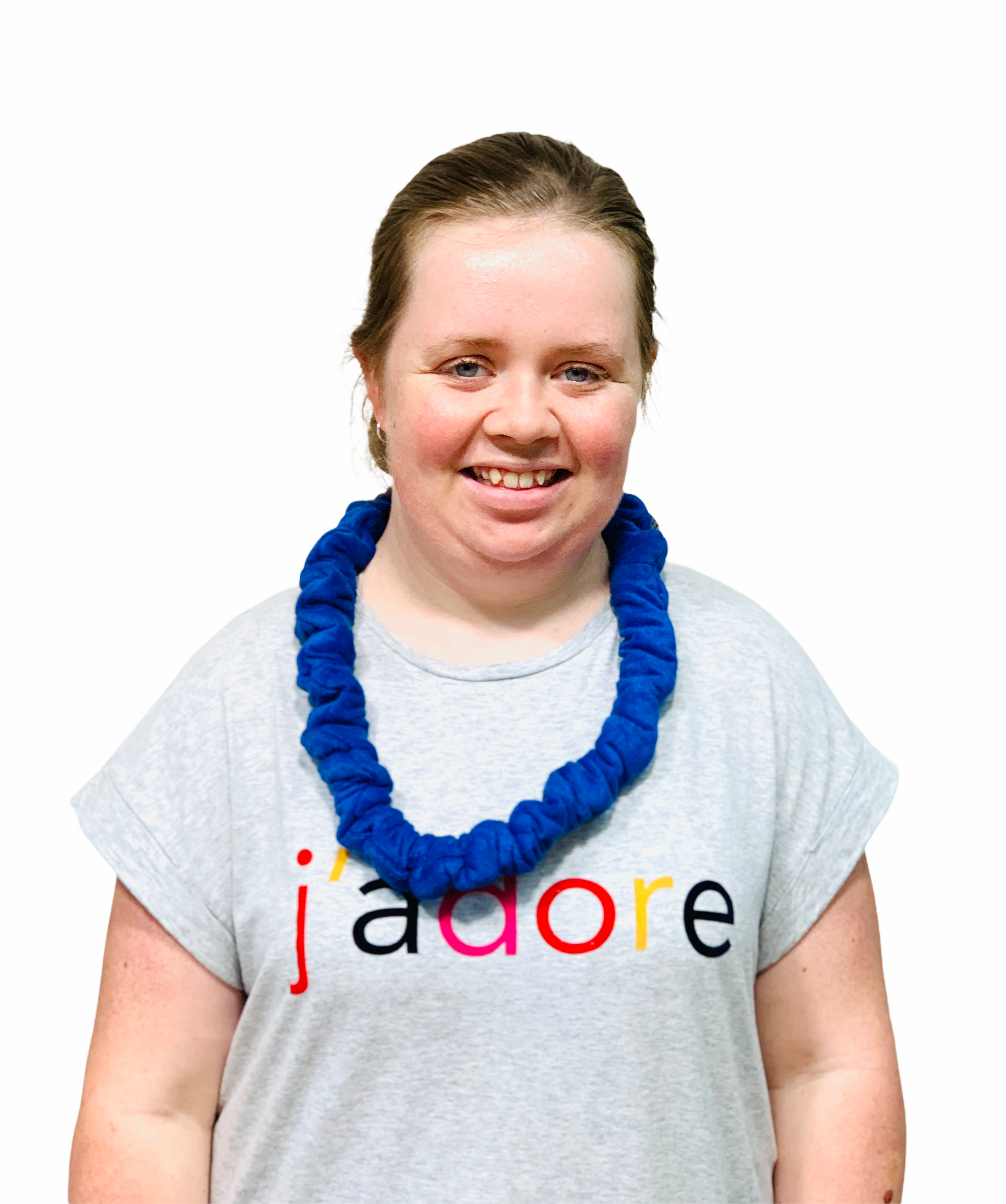 Girl wearing grey t-shirt smiling with blue Fabric Chew Bite Band - Tough around her neck