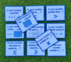 the cards from Junior Learning What&#39;s My Number? on green grass