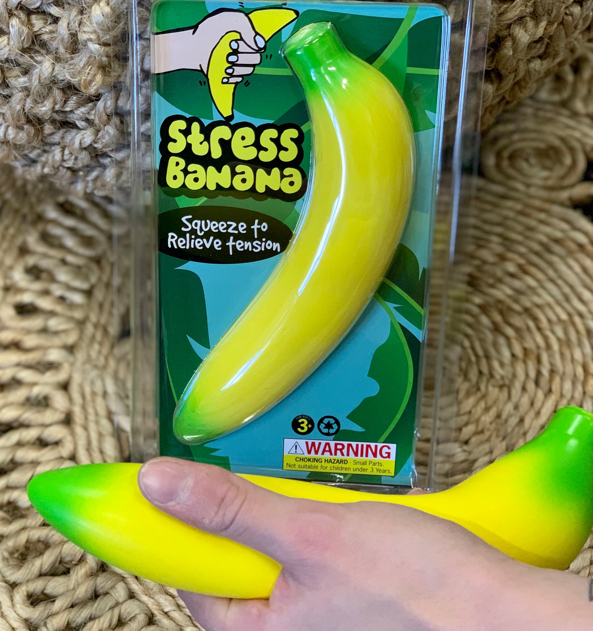 hand squeezing the Stress banana Toy